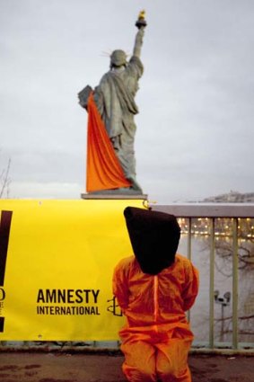 Amnesty activists protest against the camp this week.