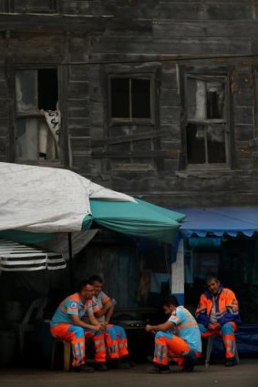 Council workers take a break in the sleepy fishing village of Garipce, Istanbul.