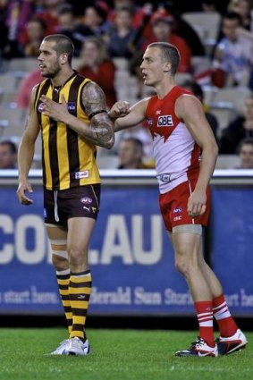 Lance Franklin is guarded by Ted Richards.