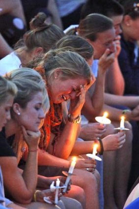 Love's teammates from the University of Virginia women's lacrosse team hold a candlelight memorial after learning of her death.