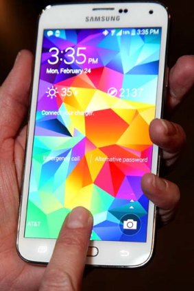 Using the Galaxy S5's fingerprint scanner.