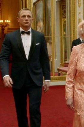 Politically correct colours ... Queen Elizabeth II, with Daniel Craig, in her Olympic outfit.