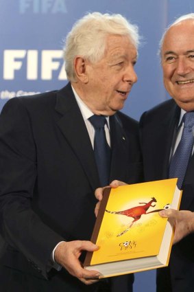 FFA Chairman Frank Lowy, left, submits Australia's official bid book for the 2018 or 2022 Soccer World Cup to FIFA President Sepp Blatter in May 2010.