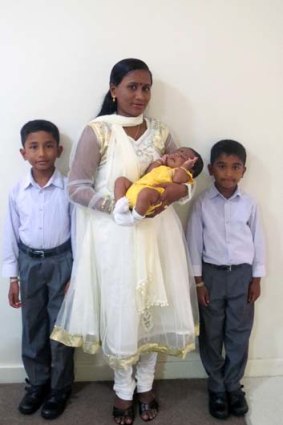 Ranjini, with her three children.