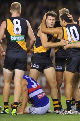Richmond players join Shane Edwards to celebrate after he scored.