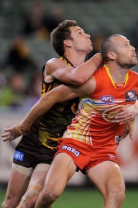 Matthew Warnock (right) is one of five delistings at Gold Coast.
