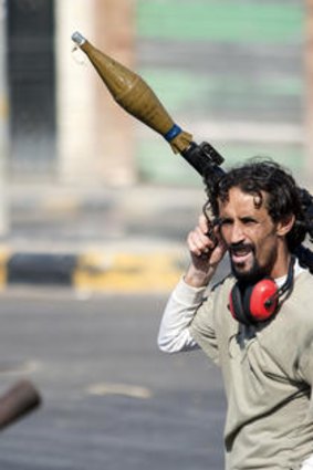 A rebel fighter celebrates in Sabratha.