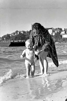 Water boy: Murray Rose as a baby take early steps at the beach, with his mother.