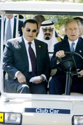 Plunder ... Hosni Mubarak rides in a golf cart driven by George W.  Bush while Saudi Arabian Crown Prince Abdullah sits in the back seat, Sharm El-Sheikh, Egypt,  2003.