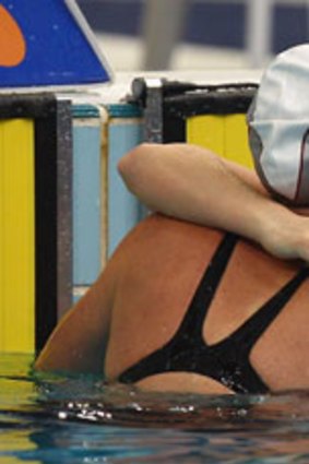 Emily Seebohm (left) hugs Belinda Hocking after the 100 metre backstroke final.