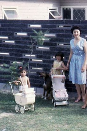 Shellie Morris as a child with her adopted family including mother Dorothea Dixon, sister Tracey and brother Craig, outside their family home.