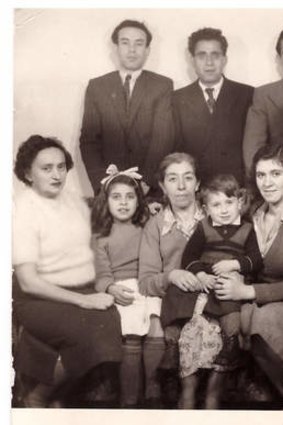 Now and then ... Gawenda's family in Melbourne in the 1950s, with the author sitting on his mother's knee.