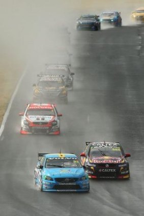 Testing conditions: Scott McLaughlin battles with Jamie Whincup at the wet Sydney Motorsport Park.