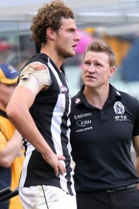 Nathan Buckley speaks with Jarrod Witts during the game.
