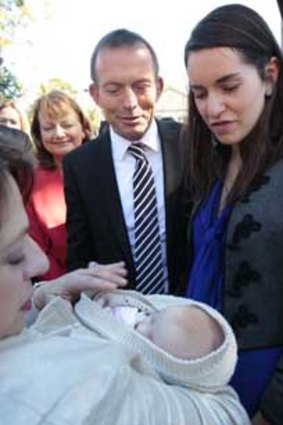 Tony Abbott and Indi candidate Sophie Mirabella meet a baby.
