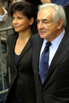 Intending to fight hard ... Dominique Strauss-Kahn and his wife Anne Sinclair leave Manhattan Supreme Court.