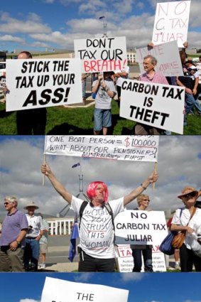 Posters at the No Carbon Tax rally outside Parliament House in Canberra in 2011.
