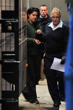 Abrahams is led to a prison van at the NSW Supreme Court in Sydney.