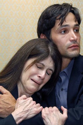 Michael Egan III, right, 31, and his mother Bonnie Mound in tears over her son's alleged abuse.