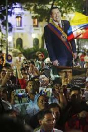 A city united in mourning  .... Venezuelans march through the streets of Caracas with an effigy of the late President Chavez.
