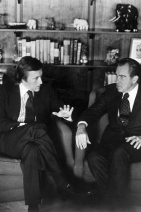 David Frost, left, talks with former President Richard Nixon prior to the taping of his interview with the former President.