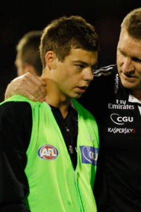 Buckley has a few words of encouragement for young Magpie Jamie Elliott.