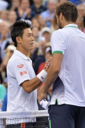 Kei Nishikori congratulates Marin Cilic on his victory.