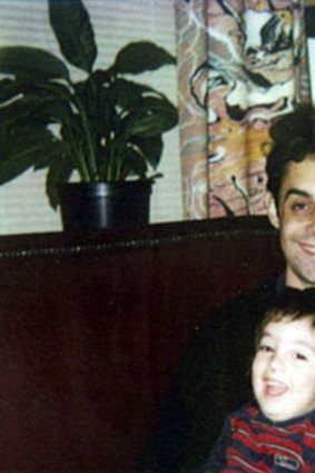 Stephen Crafti with his son in the 1980s in front of the Drysdale curtains in their home.