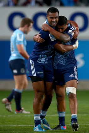 Disappointing: Lolagi Visinia of the Blues (left) is congratulated on his try by Charles Piutau during Friday's win over the Waratahs.