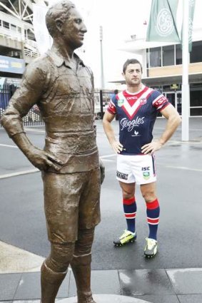 Greats: Minichiello and the statue of league legend Dally Messenger.