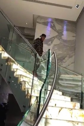 Tyga walks down the Mehajer staircase. 