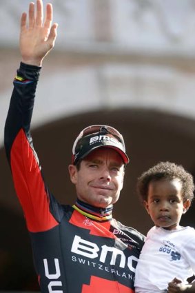 Cadel Evans on the podium with his son Robel after the Giro d'Italia.