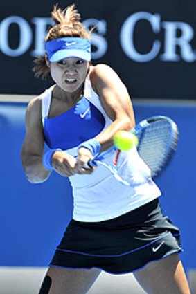 Li Na hits out during her match against Agnes Szavay.