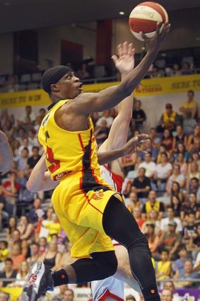 Two points: Jonny Flynn scores for Melbourne Tigers against Perth.
