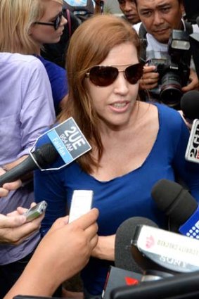 Shapelle Corby's sister Mercedes fights her way through the media pack after visiting Shapelle.