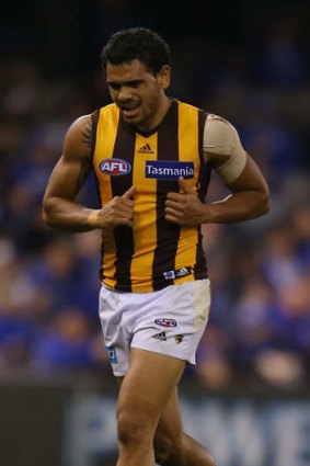 Cyril Rioli leaves the field injured.