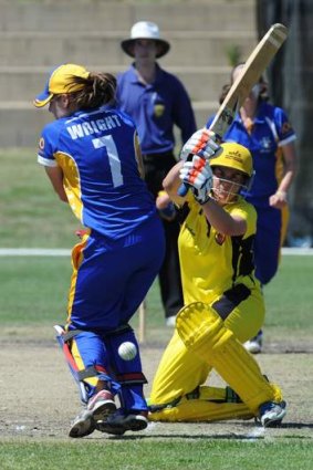 Jenny Wallace gets one past ACT wicketkeeper Laura Wright.