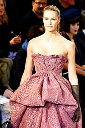 Elle Macpherson models a creation by fashion designer Marc Jacobs for Louis Vuitton.