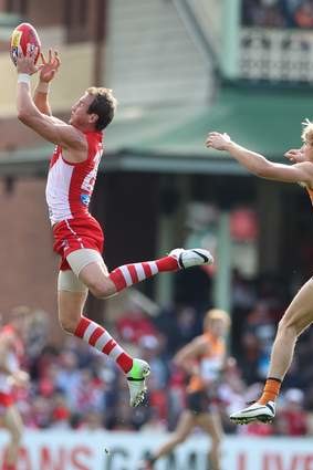 Capable hands: Jude Bolton takes a mark in the Swans 129-point massacre of GWS.