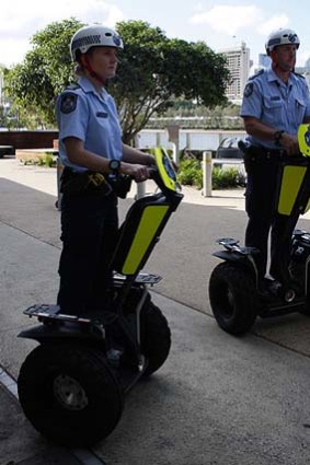 Queensland police officers rollout on Segways.