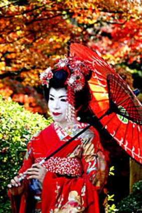 A kimono-clad woman visits Kiyomizu temple complex in Japan's ancient city Kyoto.