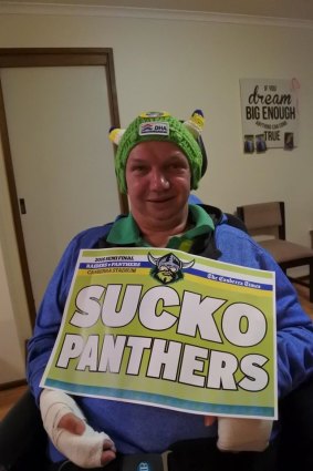 Brian Connell with the "Sucko Panthers'' poster printed for him by The Canberra Times.