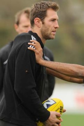 Travis Cloke's manager says talks will resume at the end of the Pies' season.