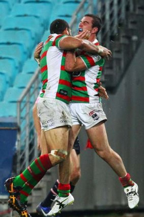 Greg Inglis and Justin Hunt celebrate a try.
