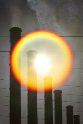 The sun behind stacks of a Latrobe Valley coal plant.