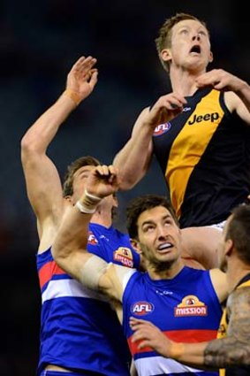 Jack Riewoldt flies high over a pack.