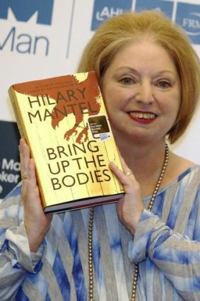 Hilary Mantel poses with her book <i>Bring Up the Bodies</i>, after winning the 2012 Man Booker Prize.