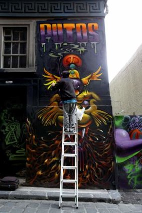 Hosier Lane in Melbourne  gets its latest makeover.  The Age. Photo: Angela Wylie. November 29 2013.