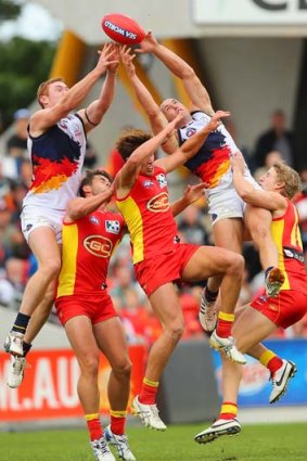On a high: Crows Tom Lynch and Jason Porplyzia get above the pack.