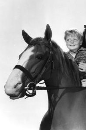 My kingdom for a horse: Elizabeth Taylor and Mickey Rooney in a scene from <i>National Velvet.</i>
